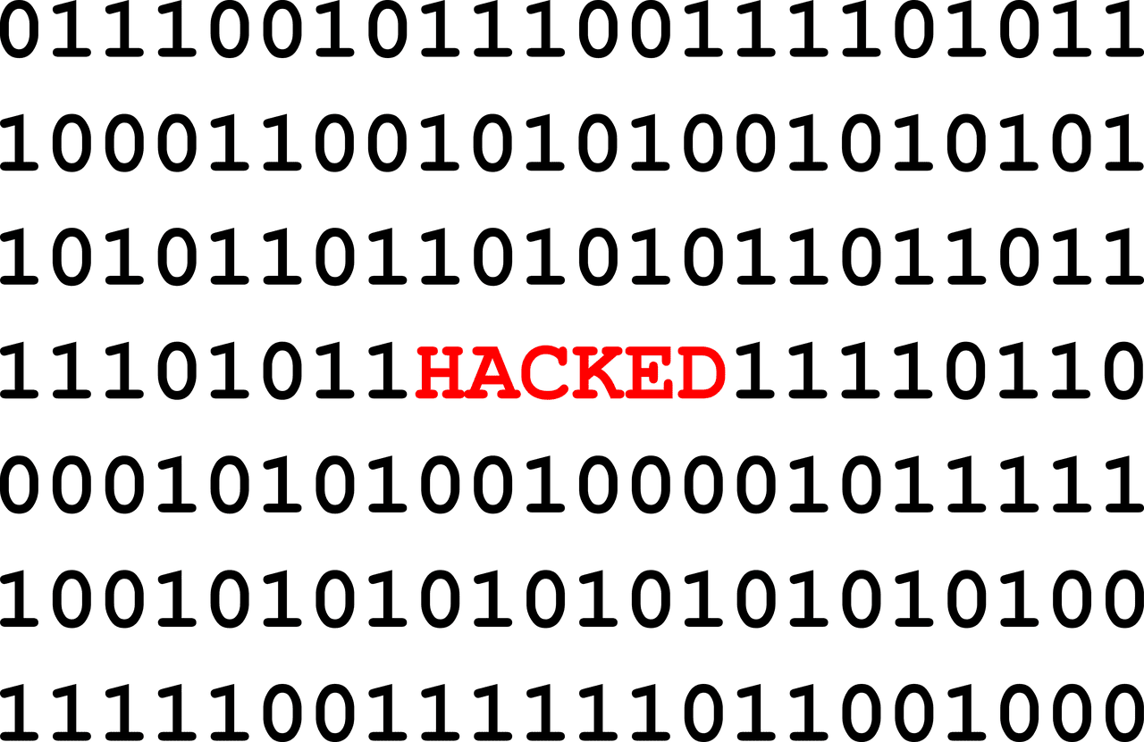 Hacked A set of binary numbers with the word hacked in between.