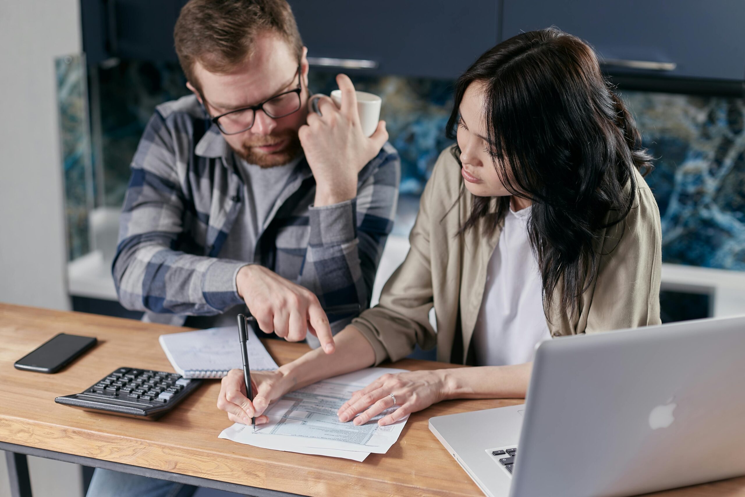 8-Strategies-for-Tackling-Technical-Debt-at-Your-Company-scaled.jpg Free couple calculating al their bills stock photo